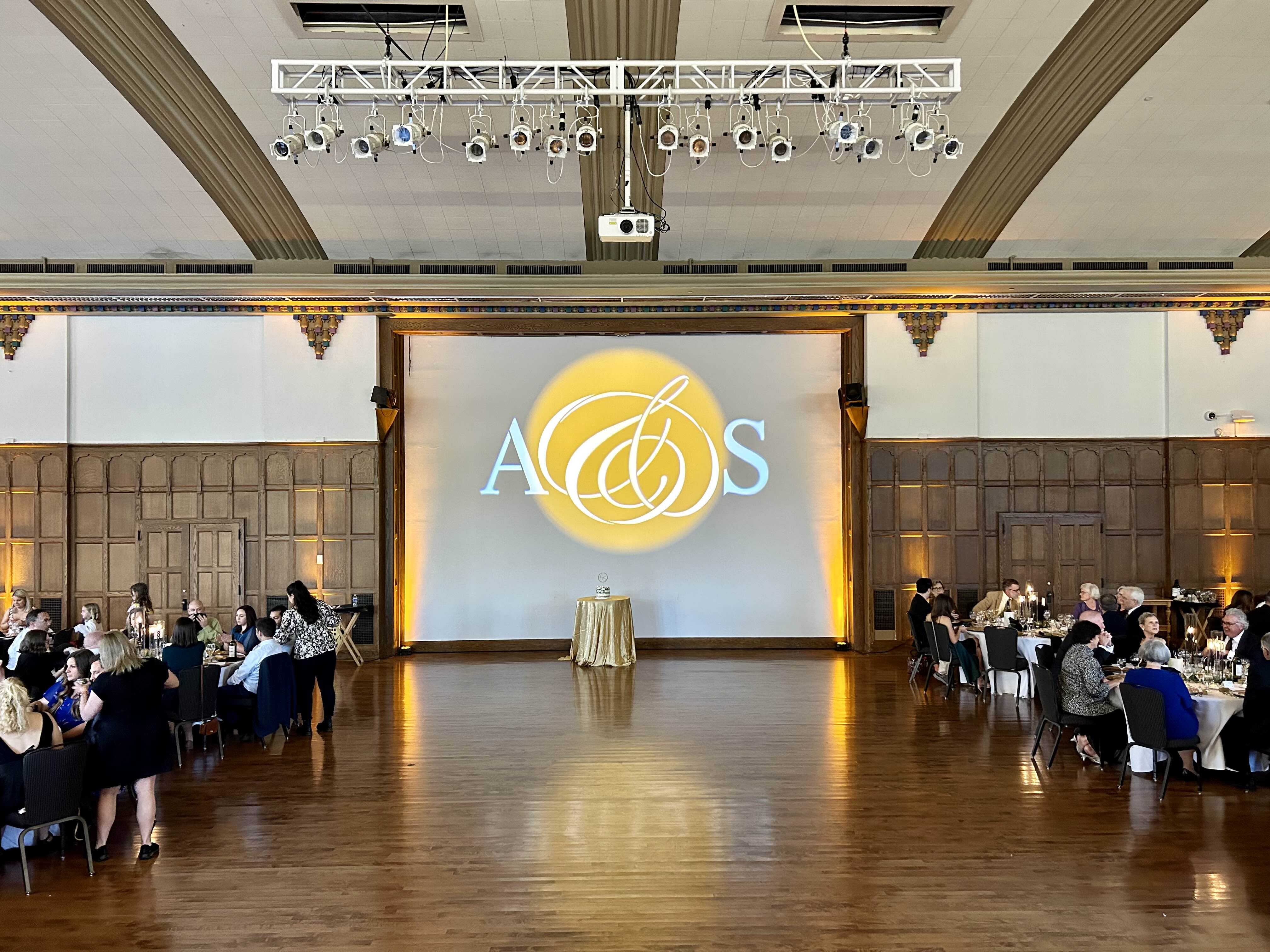 Elegant ballroom reception with custom monogram lighting projection