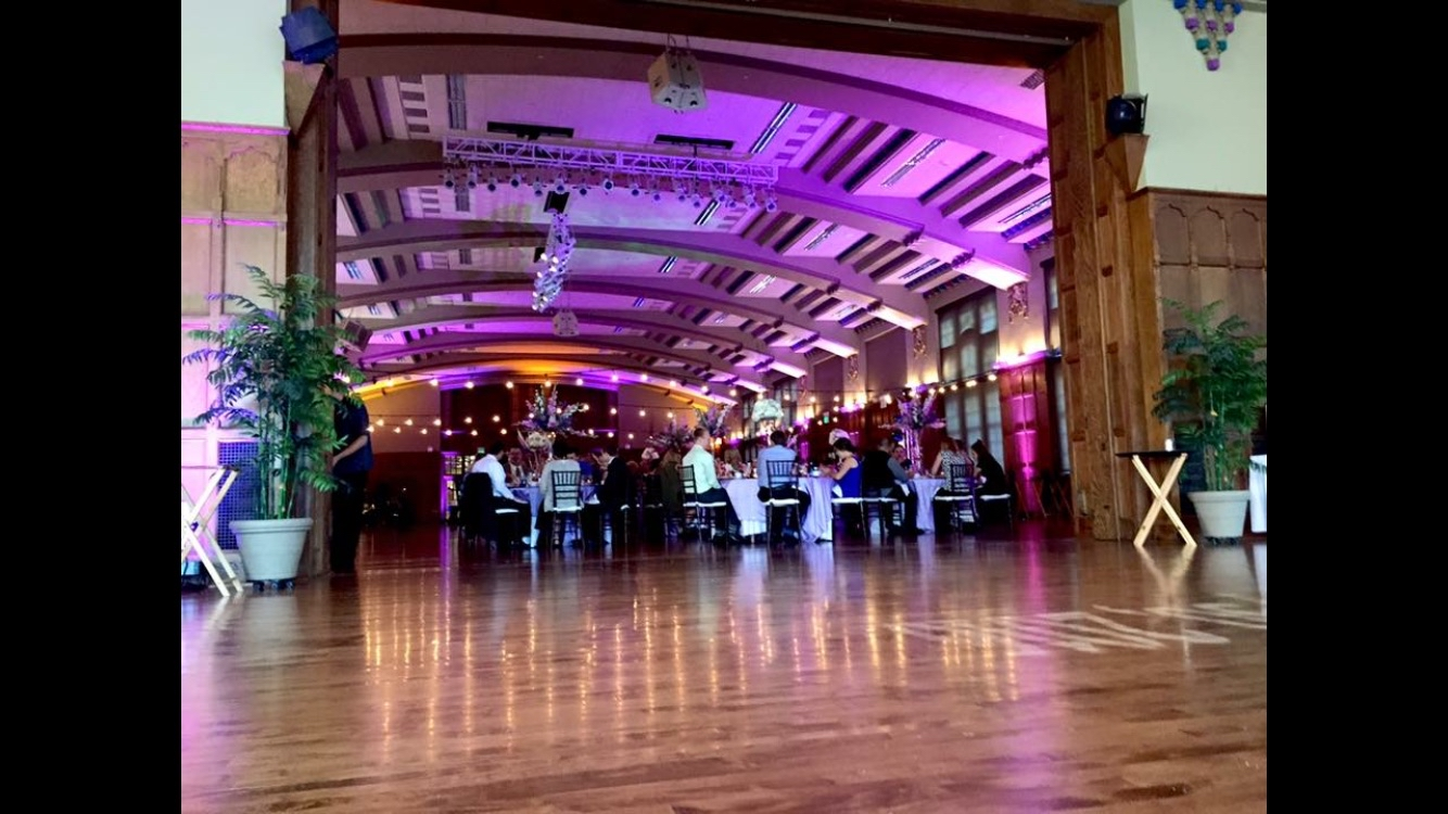 Stunning ballroom with arched ceiling and purple uplighting