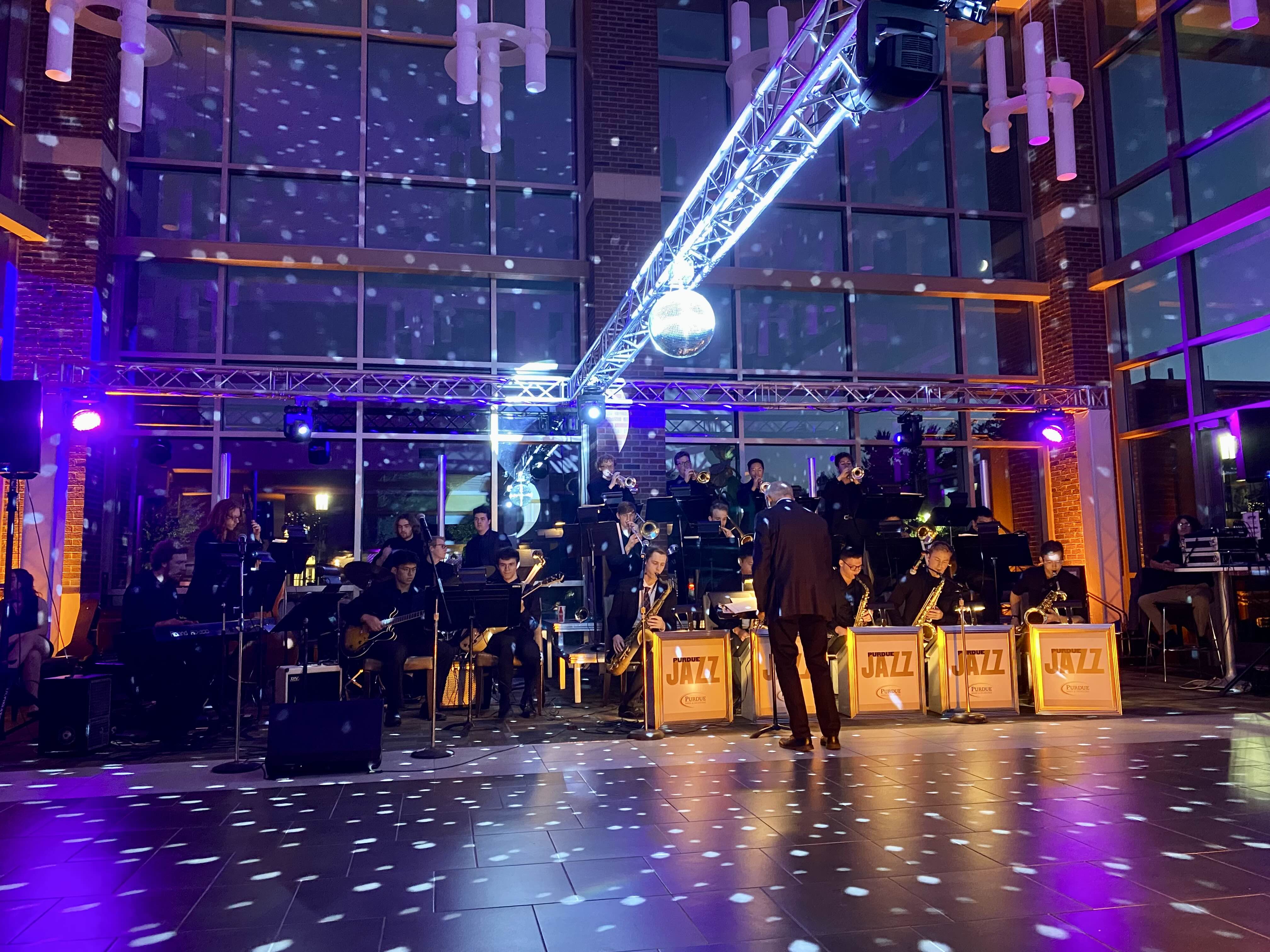 Modern venue with full jazz band and snow effect projections